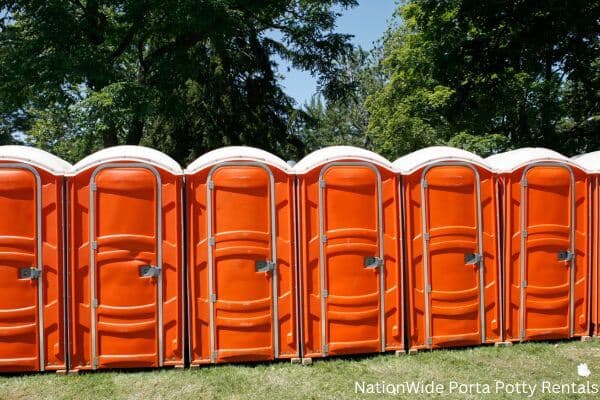 a lineup of clean and well-maintained portable loos for workers in Waldoboro, ME