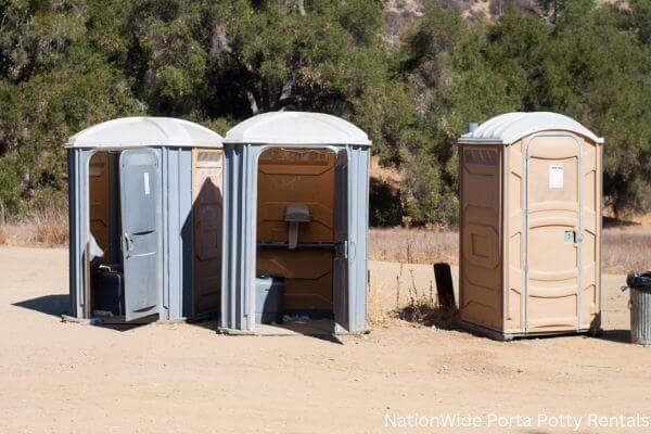 a clean row of portable restrooms for outdoor weddings or festivals in Dixfield, ME